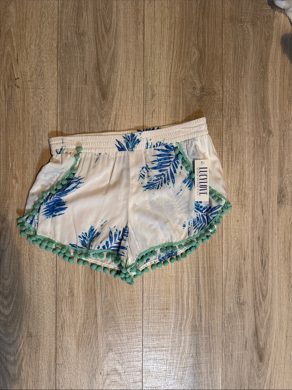 Lucy Love White Swim Shorts with Blue Leaf Print and Mint Pom Trim
